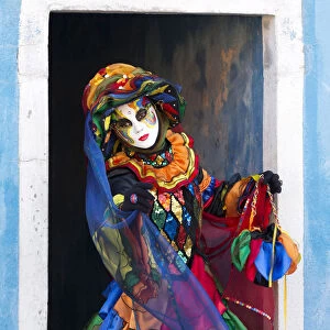 Colourful costume worn during the Venice Carnival on the island of Burano, Venice