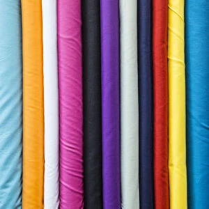 Colourful cotton fabrics for sale in Souk Waqif, Doha, Qatar