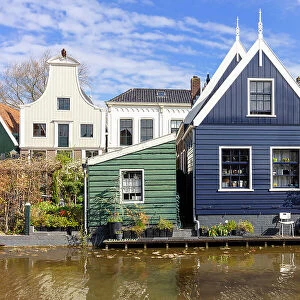 Colourful houses line the canal in the village of De Rijp, North Holland, Netherlands