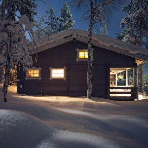Cottage covered by snow. Sallatunturi. Lapland, Finland