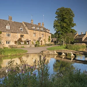 Cottages beside the River Eye in the picturesque Cotswold village of Lower Slaughter