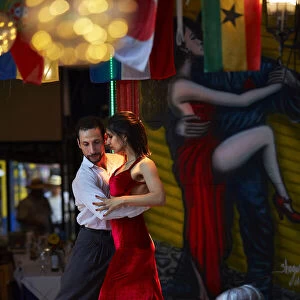 A couple of tango dancers perform a live-show in a restaurant of La Boca, Buenos Aires