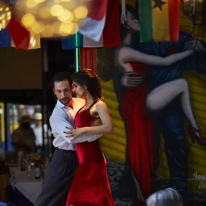 A couple of tango dancers perform a live-show in a restaurant of La Boca, Buenos Aires