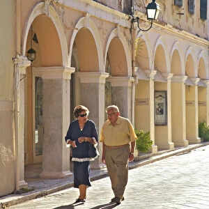 Couple Walking Through Corfu Old Town, Corfu, The Ionian Islands, Greek Islands, Greece