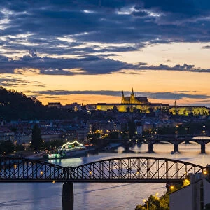 Czech Republic, Prague. Prague Castle, Pazsky Hrad, and the Vltava River at sunset