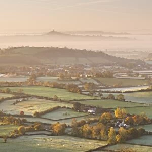Dawn view over misty Somerset Levels countryside towards Glastonbury Tor, Somerset, England
