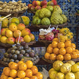 Different varieties of passion fruit and local fruit at Mercado dos Lavradores