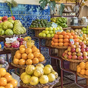 Different varieties of passion fruit and local fruit at Mercado dos Lavradores