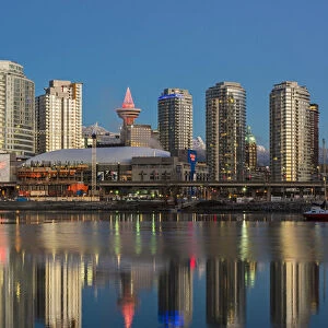 Downtown skyline reflected into the False Creek at sunrise, Vancouver, British Columbia