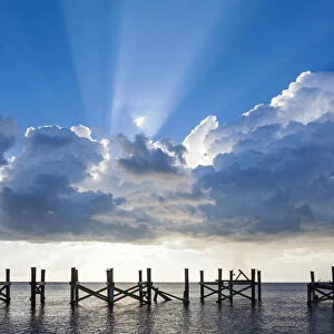 Dramatic clouds and sunbeams over a blue sky. Lake Pontchartrain, New Orleans, Louisiana