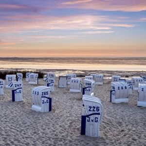 Duhnen, Cuxhaven, Lower Saxony, Germany. Strandkorb beach chairs and the Wadden Sea