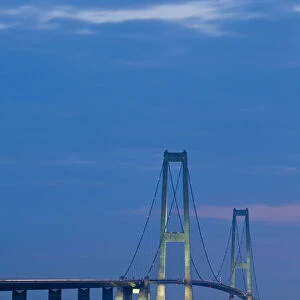 Dusk over the illuminated East Bridge as seen from Korsor, Denmark