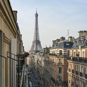Elevated street view with Eiffel Tower in the background, Paris, France