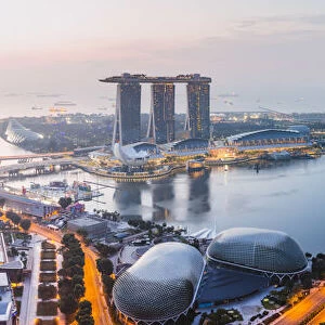 Elevated view of business district and Marina bay Sands at sunset, Singapore