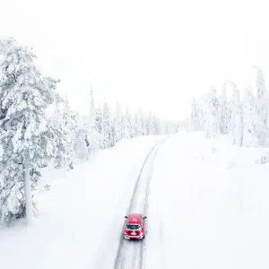 Elevated View of Car on Snowy Road Print Elevated View of Car on Snowy Road Print