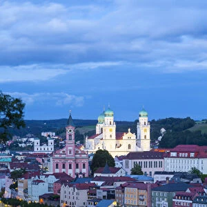 Elevated view towards the picturesque city of Passau illuminated at dusk, Passau