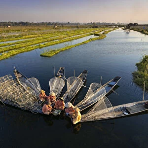 Elevated view of traditional fishermen on Lake Inle having a supper on boats together