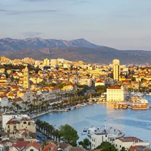 Elevevated view over the picturesque harbour city of Split illuminated at sunset