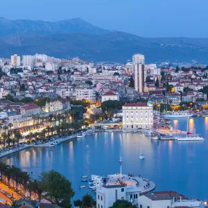 Elevevated view over Stari Grad & harbour illuminated at dusk, Split, Dalmatia, Croatia