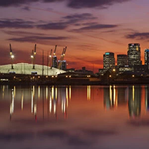 England, London, Newham, O2 Arena and Canary Wharf buildings reflecting in Royal
