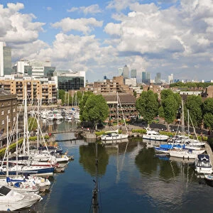England, London, St Katherines Dock with Canary Wharf in the background