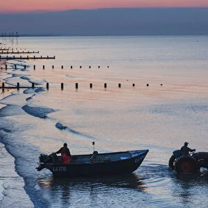 England, West Sussex, Bognor Regis, Fishermen Departing at Dawn