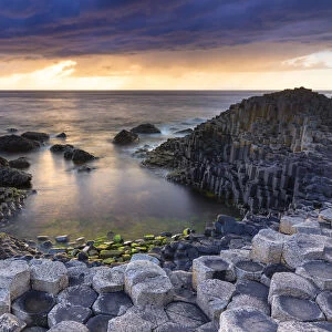 An epic sunset at the Giants Causeway with its iconic basalt columns
