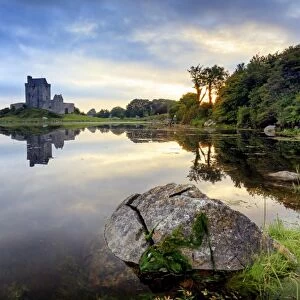 Europe, Dublin, Ireland, Dunguaire castle in Kinvara village at sunrise reflecting