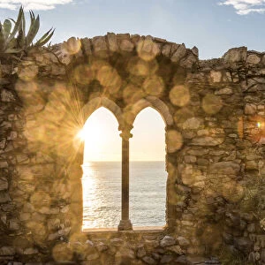 Europe, Italy, Liguria, Portovenere. Sunset seen through the old ruins