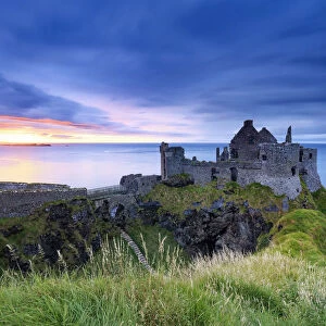 Europe, Northern Ireland, Dunluce Castle at sunset