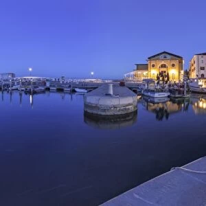 Europe, Slovenia, Istria, Piran. The picturesque port and the buildings around it at dusk