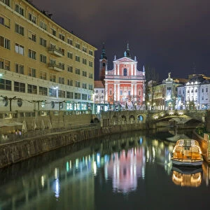 Europe, Slovenia, Ljubljana. Tromostovje in the city center by night