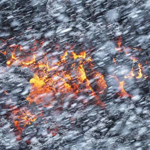 Falling snow and lava coming from the Fagradalsfjall eruption