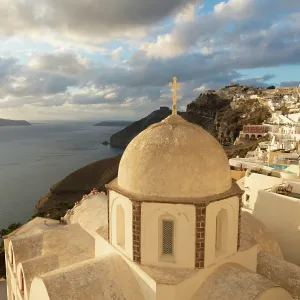 Fira with an old domed church in the foreground, Fira, Santorini, Cyclades Islands, Greece, Europe