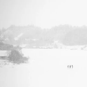Fishermen on the frozen Volkhov River with Nikolsky monastery in the background, Staraya