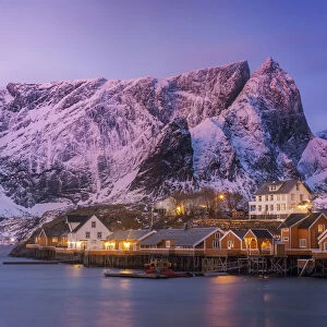 Fishermens cabins (rorbuer) of Sakrisoy along the coast at sunrise in the Lofoten