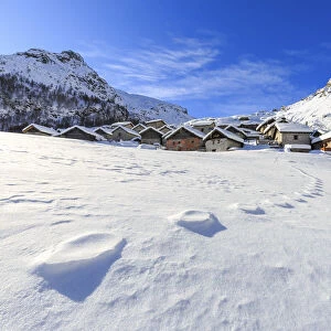 Footprints in the snow at Alpe Lendine. Vallespluga, Valchiavenna, Valtellina, Lombardy