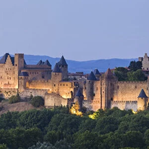 Fortified town of La Cite Carcassonne at illuminated at dusk, Languedoc-Roussillon