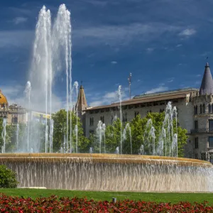 Fountain in Plaza Catalunya with Casa Rocamora modernist building behind, Barcelona