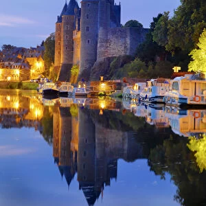 France, Brittany, Morbihan, Josselin, Chateau de Rohan castle on the Oust River at night