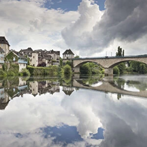 France, Correze, Argentat, The old town and bridge reflected in the Dordogne river