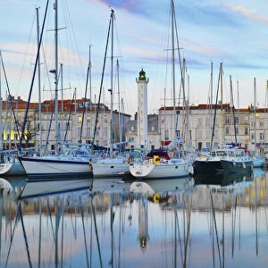 France, poitou-Charentes, La Rochelle, town reflected in harbour at dusk