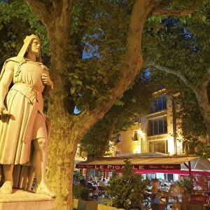 France, Provence, Orange, Place de la Republic, Rimbaud 11 statue at dusk