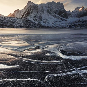 Frozen lake near Nusfjord in the Lofoten islands, Norway