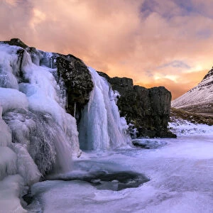 Frozen Waterfall and Kirkjufell at Sunset, Iceland