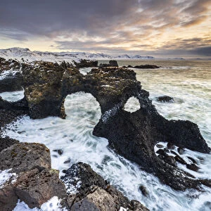 Gatklettur arch at sunrise, Arnarstapi, Hellnar, Snaefellsnes Peninsula, Iceland