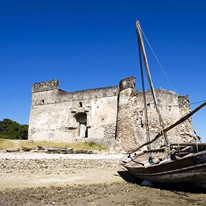 Gerezani an ancient fort with traditional dhow, Kilwa Kisiwani, coast of Tanzania