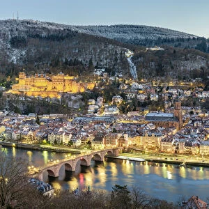 Germany, Baden-WAorttemberg, Heidelberg. Altstadt (old town) on the Neckar River at dusk