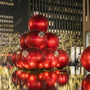 Giant red Christmas ornaments on display on Avenue of Americas (6th Avenue) during