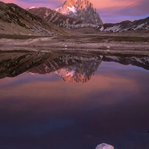 Gran Sasso Mountain at sunrise reflected in the lake, Campo Imperatore, L Aquila